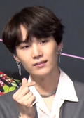 https://upload.wikimedia.org/wikipedia/commons/thumb/c/cc/180524_Suga_at_a_press_conference_for_Love_Yourself_Tear_%281%29.png/120px-180524_Suga_at_a_press_conference_for_Love_Yourself_Tear_%281%29.png
